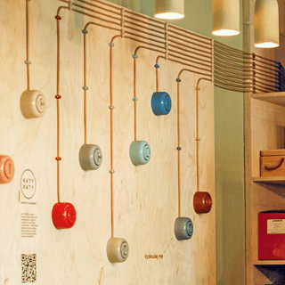 PORCELAIN KATY PATY COLONA ROUND SURFACE MOUNTED DOUBLE SLIM BUTTON SWITCH COPPER - DYKE & DEAN