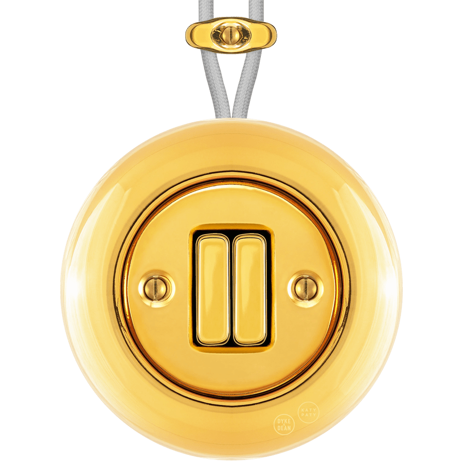 PORCELAIN KATY PATY COLONA ROUND SURFACE MOUNTED DOUBLE SLIM BUTTON SWITCH GOLD - DYKE & DEAN
