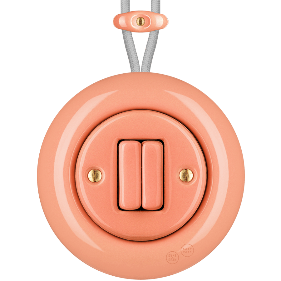 PORCELAIN KATY PATY COLONA ROUND SURFACE MOUNTED DOUBLE SLIM BUTTON SWITCH SALMON PINK - DYKE & DEAN