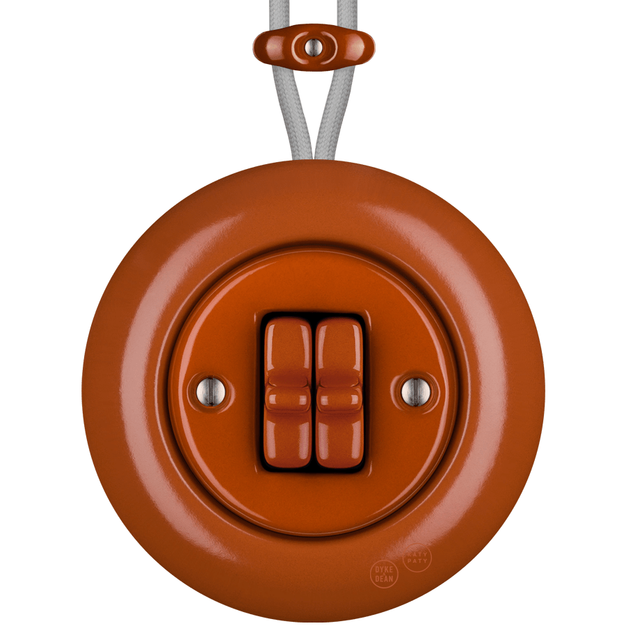 PORCELAIN KATY PATY COLONA ROUND SURFACE MOUNTED DOUBLE TOGGLE BUTTON SWITCH BRICK RED - DYKE & DEAN