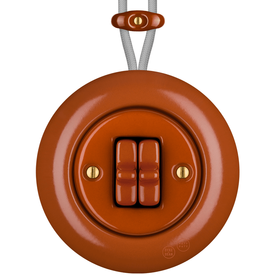 PORCELAIN KATY PATY COLONA ROUND SURFACE MOUNTED DOUBLE TOGGLE BUTTON SWITCH BRICK RED - DYKE & DEAN